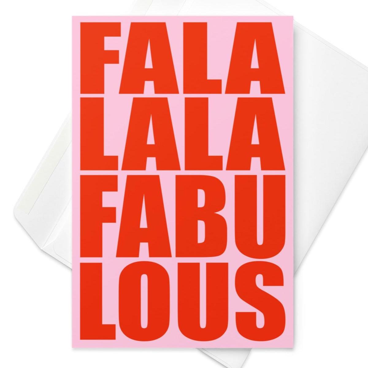 Funny Christmas greeting card featuring bold red retro typography reading “Fa La La Fabulous” on a light pink background.