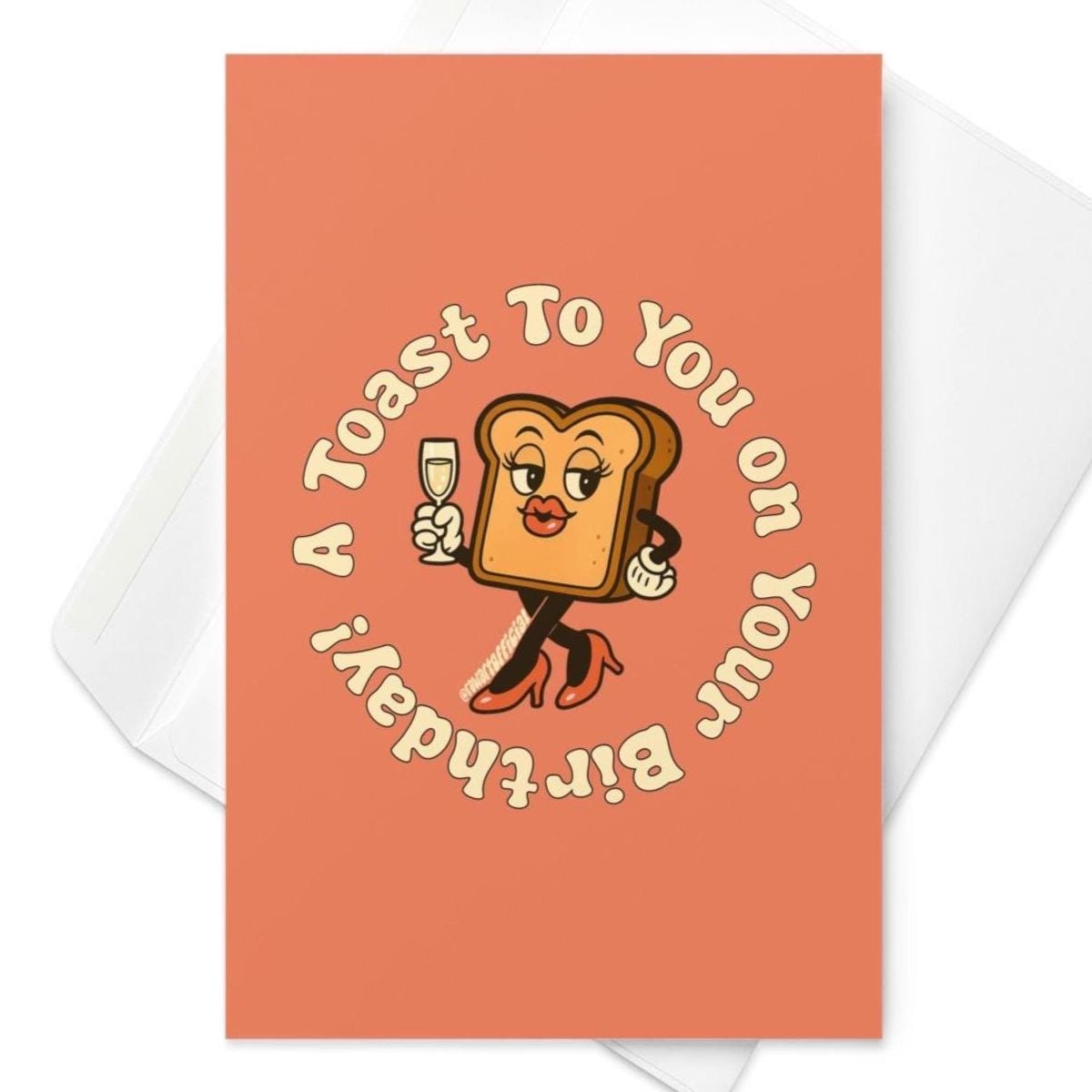 Orange birthday card featuring glamorous toast holding champagne glass with circular text βA Toast To You On Your Birthday.β