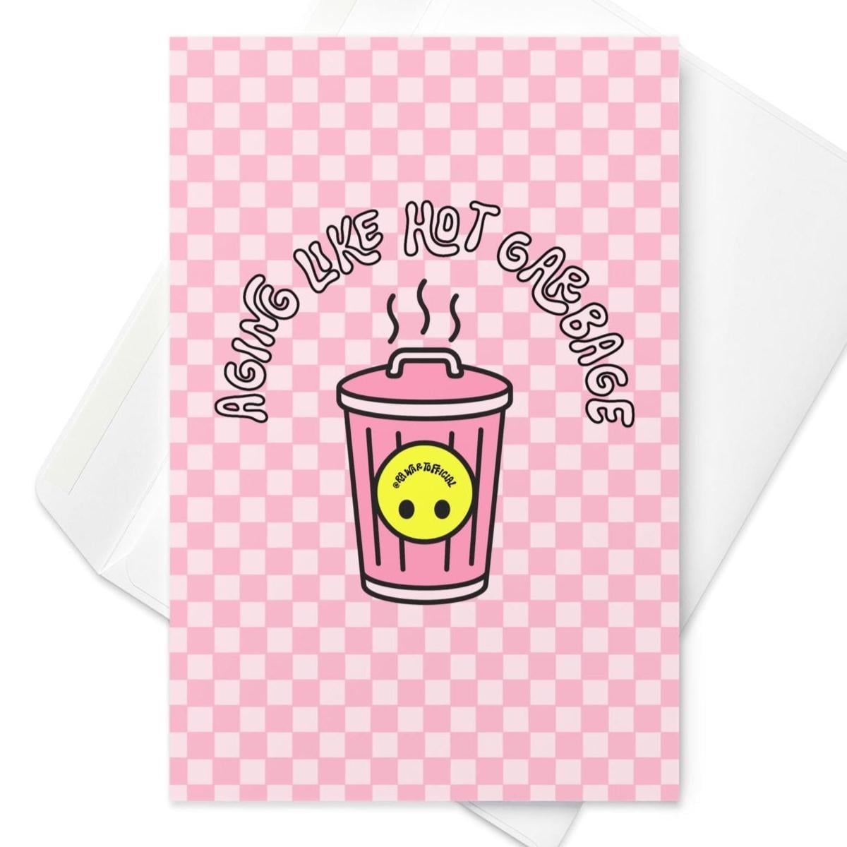 Funny “Aging Like Hot Garbage” birthday card with pink checkered retro trash can design