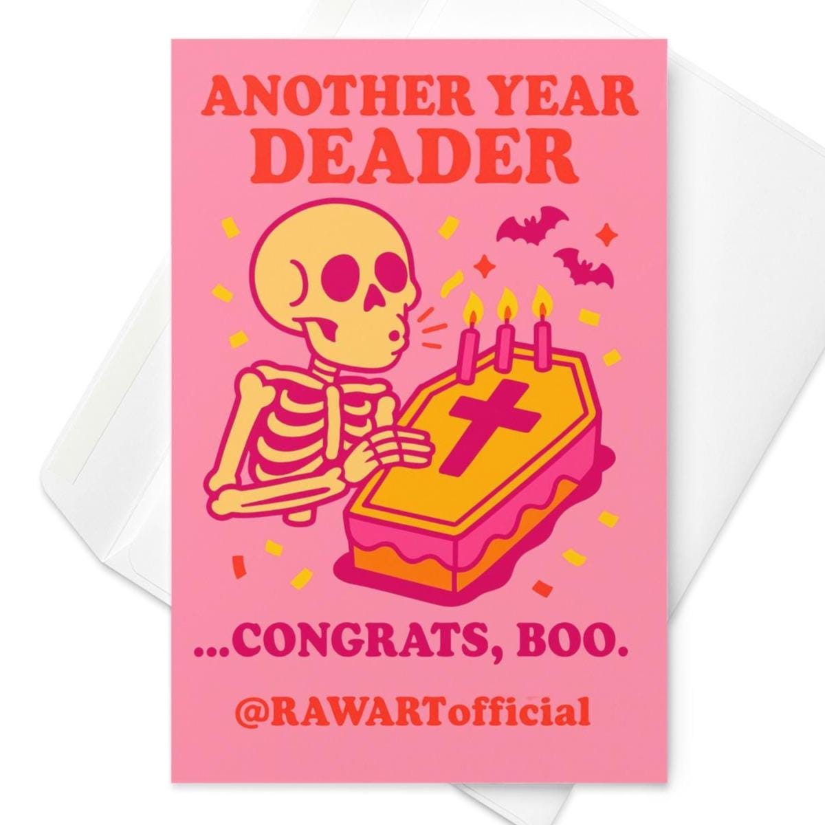 Pink skeleton birthday card with coffin cake and candles, reading “Another Year Deader …Congrats, Boo.”