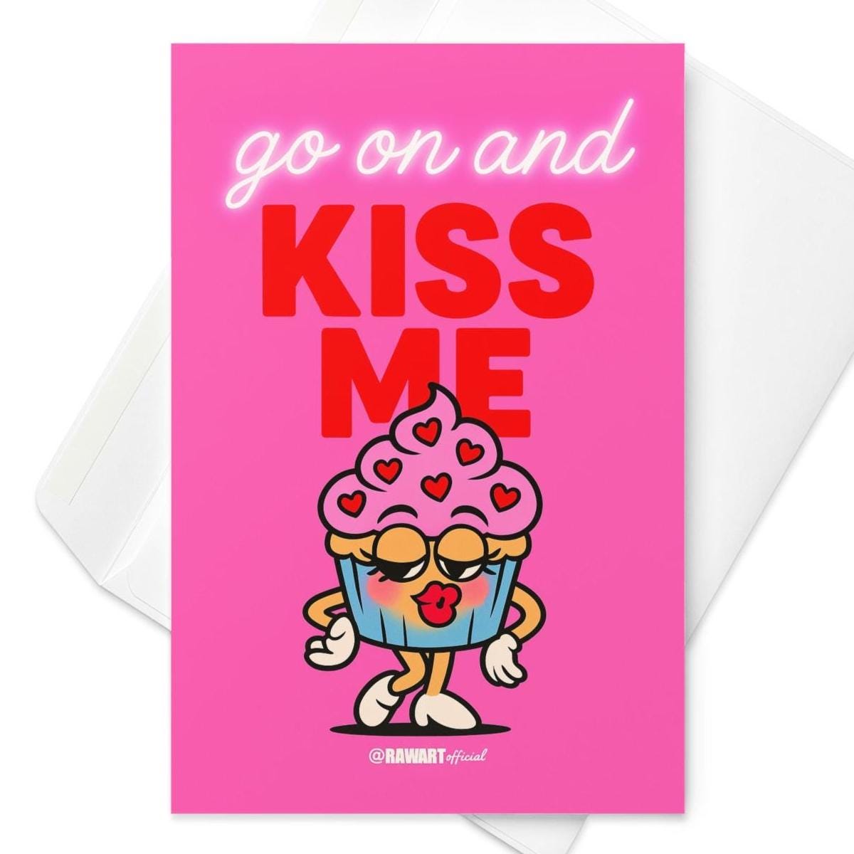 Funny greeting card reading “Go On and Kiss Me” with a cartoon cupcake blowing a kiss on a bright pink background.