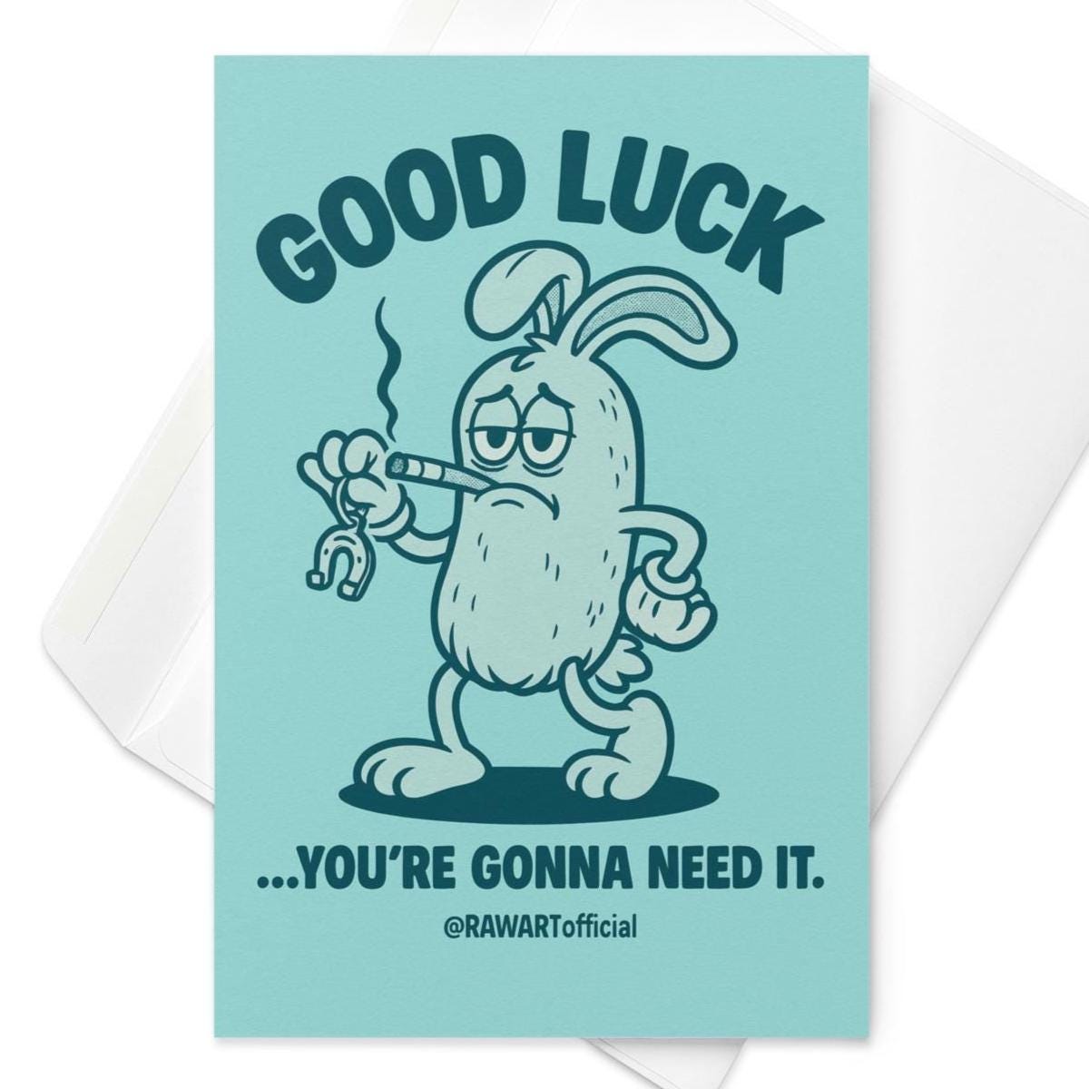 Greeting card featuring a grumpy cartoon rabbit holding a bent horseshoe with the text “Good Luck… You’re Gonna Need It.”