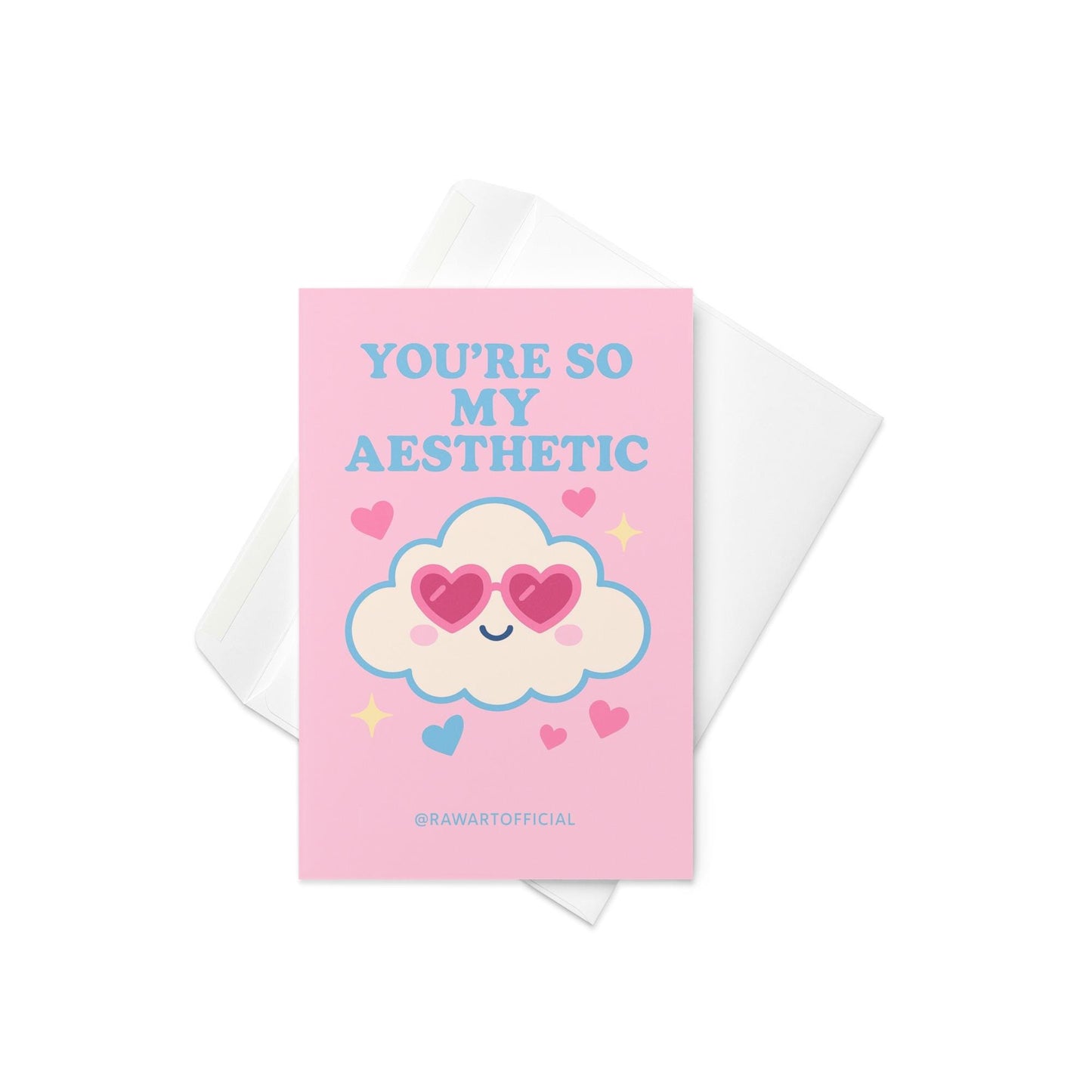 Pink greeting card with blue text reading You’re So My Aesthetic and heart-eyes cloud illustration with @rawartofficial signature.