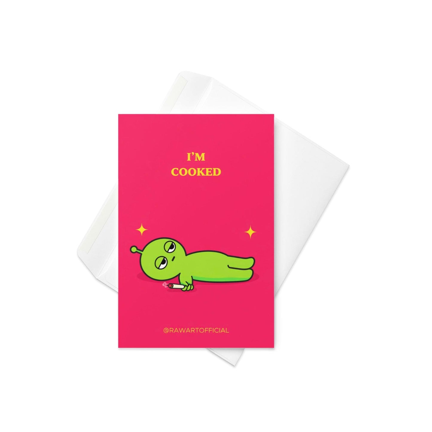 Funny stoner greeting card with green alien lying down holding joint, text says “I’m cooked” on pink background