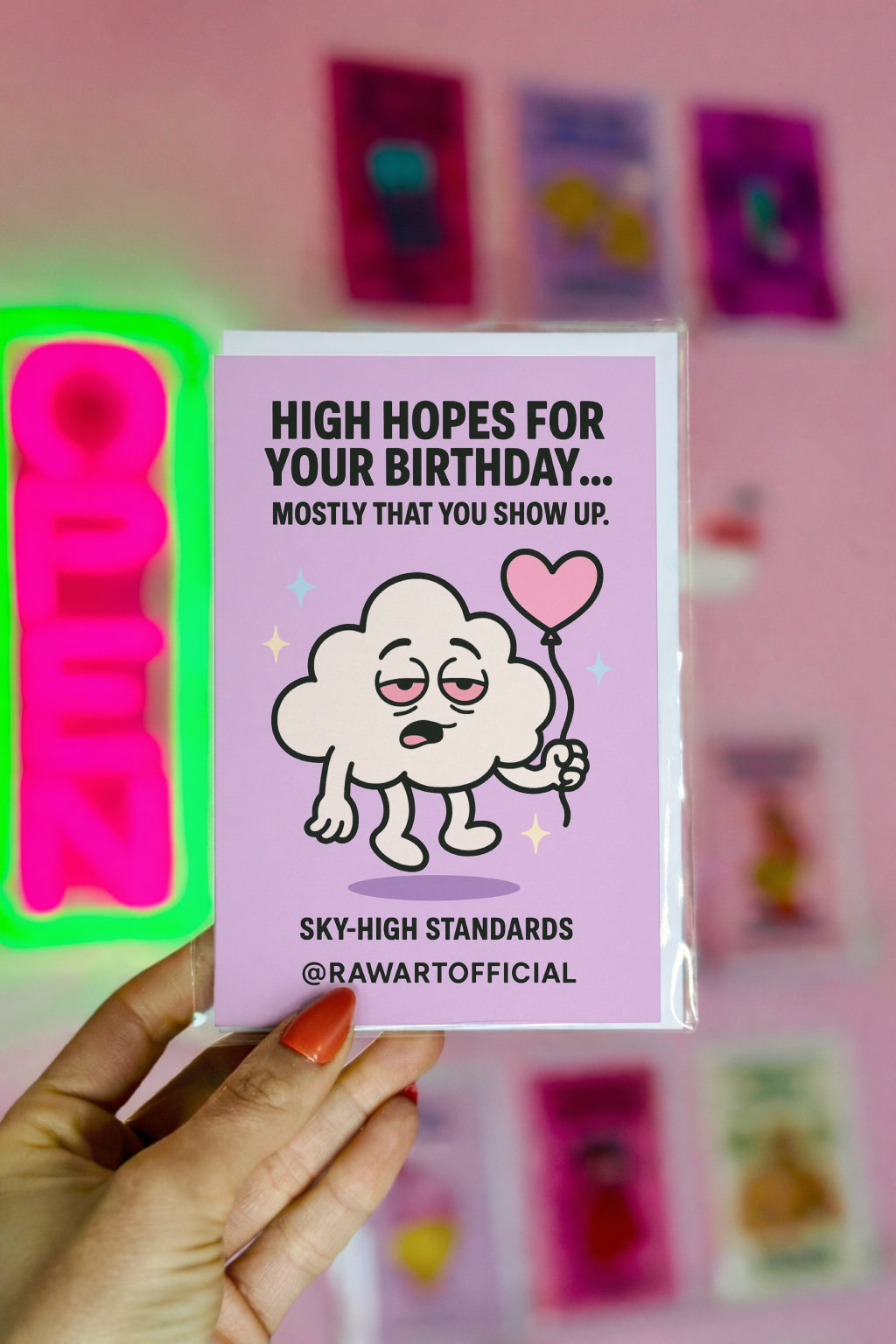 Stoned cloud holding a heart balloon on purple background with text “High Hopes for Your Birthday.”