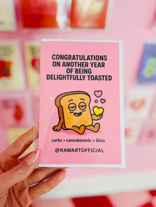 Cute toasted bread cartoon character looking high holding a yellow heart on a pink background celebrating a stoner birthday.
