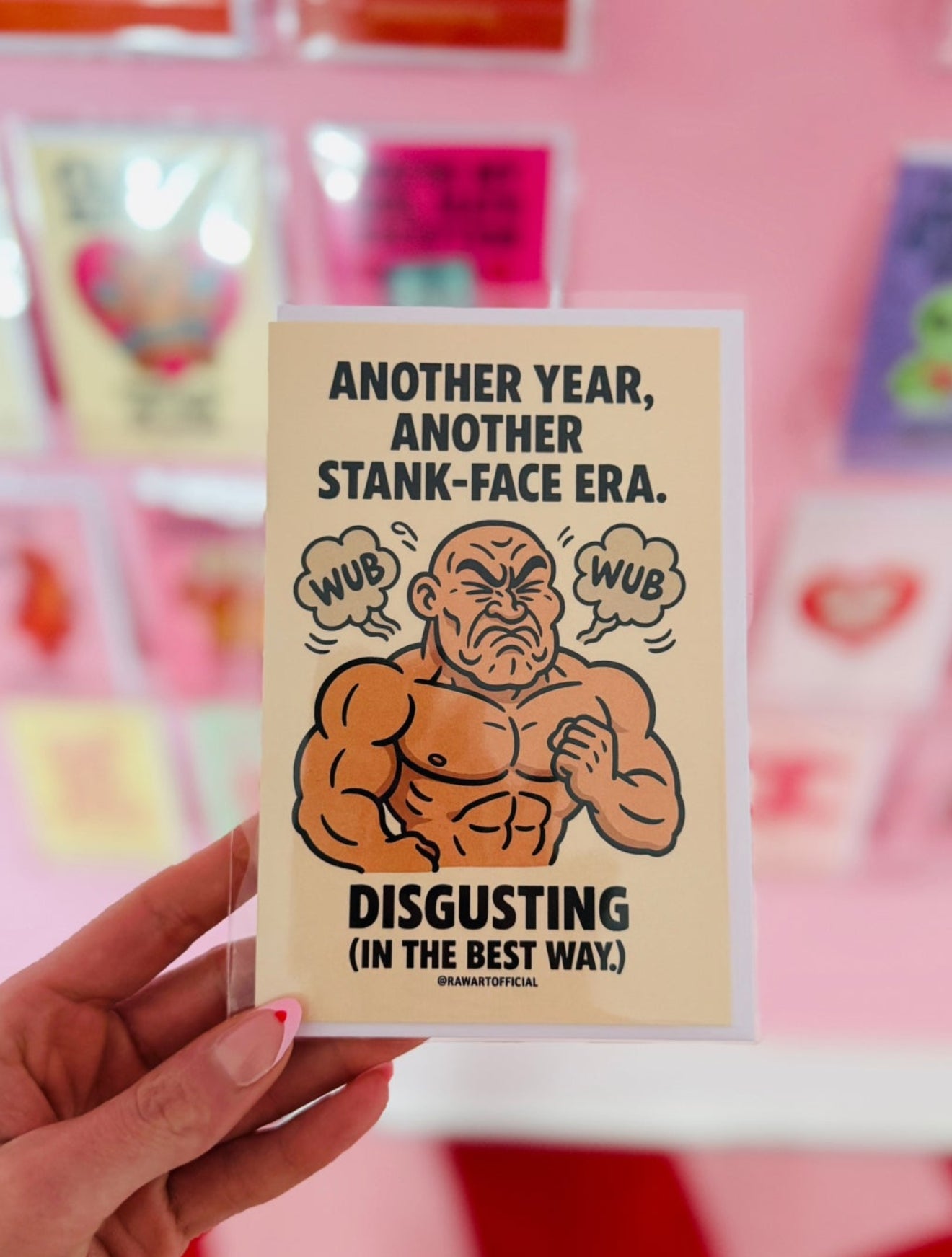 Buff man making a stank face with wub clouds around him on a funny rave themed birthday card.