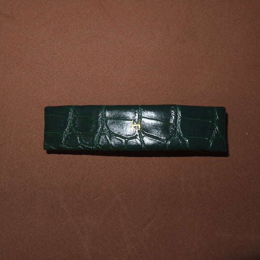 Cute green alien blushing with wiggling antennas and hearts on pink background, valentine card art.