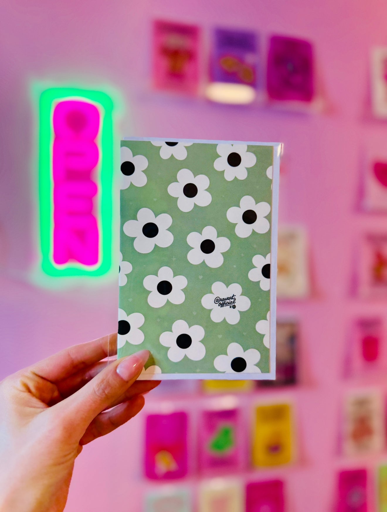 Cute daisy pattern card with white retro flowers and dark centers on sage green background aesthetic floral design