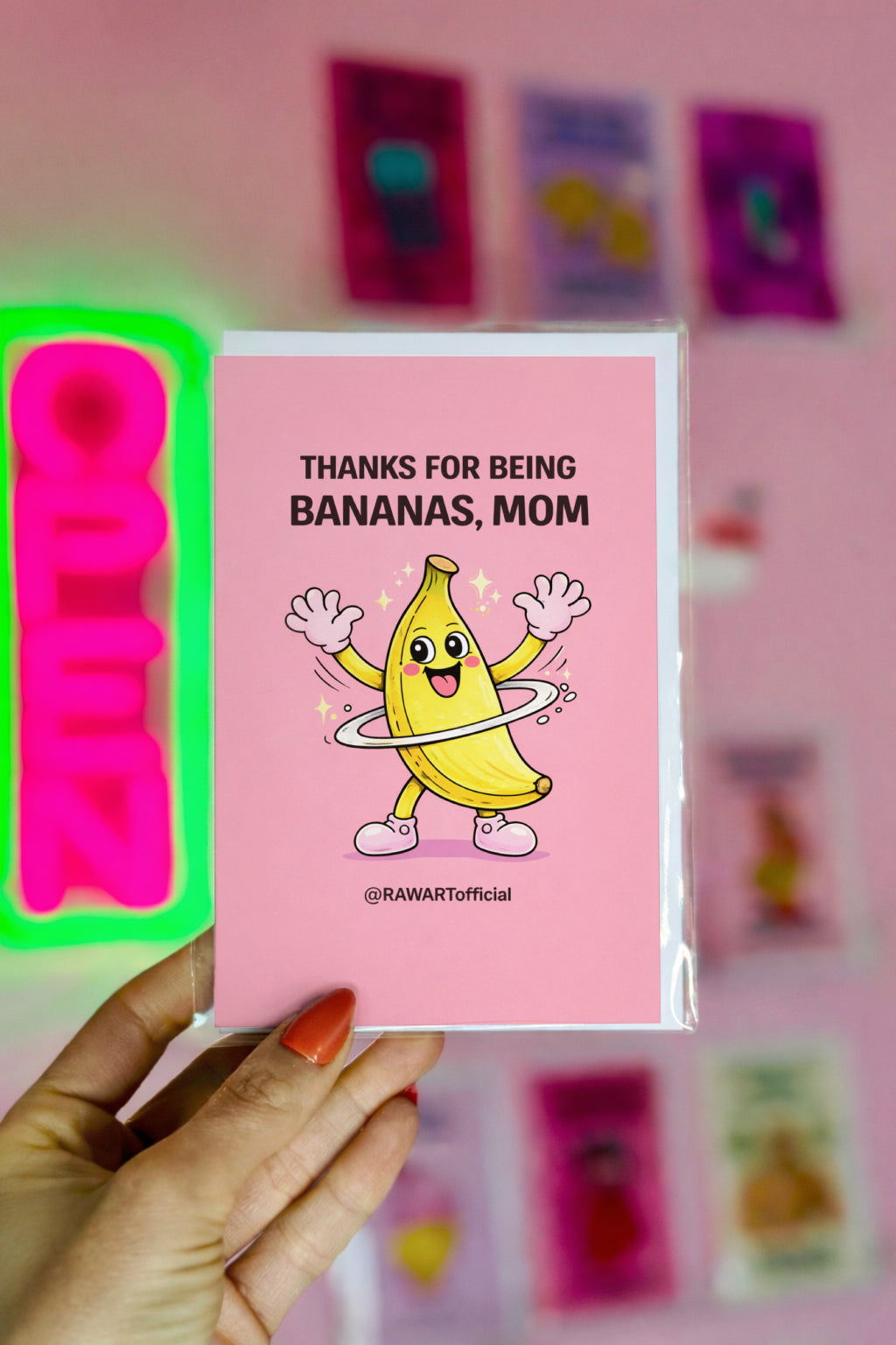 funny mother’s day card with smiling banana character spinning on pink background thanks for being bananas mom illustration