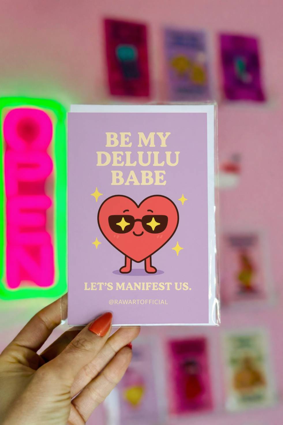 Greeting card with heart wearing star sunglasses and text “Be My Delulu Babe.”