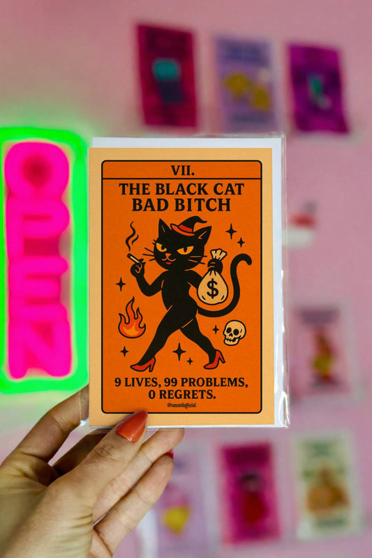 Halloween greeting card featuring a sassy black cat in heels with a money bag, tarot-style design, text reads “The Black Cat Bad B*tch.”