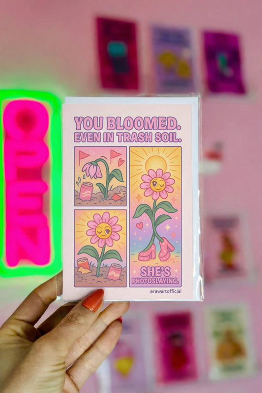 Pastel encouragement card with flower blooming in trash soil and text You Bloomed Even in Trash Soil.