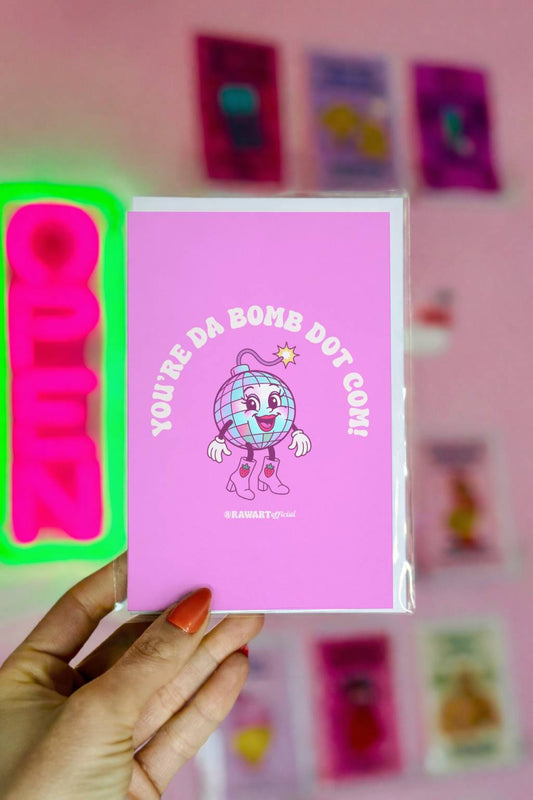 Pink Y2K style card with smiling disco bomb character and text You’re Da Bomb Dot Com.
