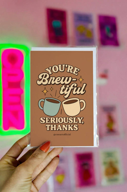 Brown thank you card featuring two coffee mugs clinking with the phrase “You’re Brew-tiful Seriously, Thanks.”