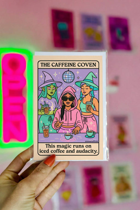 Pastel witch-themed greeting card with three witches drinking iced coffee under a disco ball, captioned “This magic runs on iced coffee and audacity.”