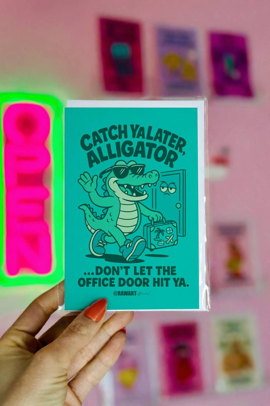 Greeting card featuring a cartoon alligator with a suitcase leaving an office door with the text “Catch Ya Later, Alligator.”