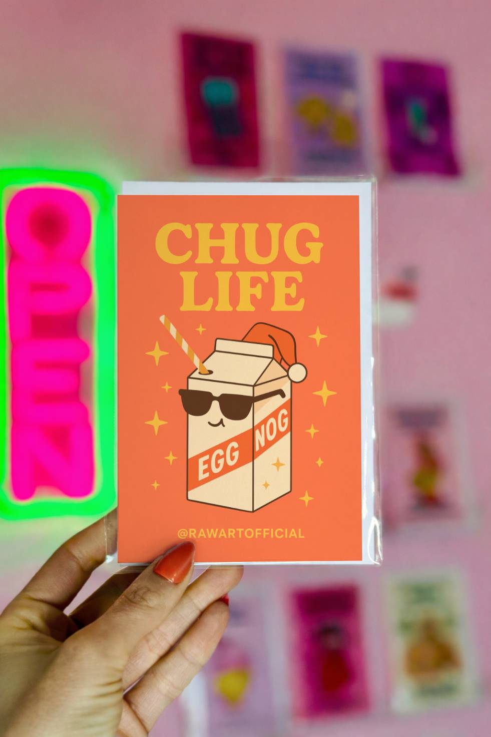 Funny Christmas card featuring eggnog carton wearing sunglasses and Santa hat with text “Chug Life.”