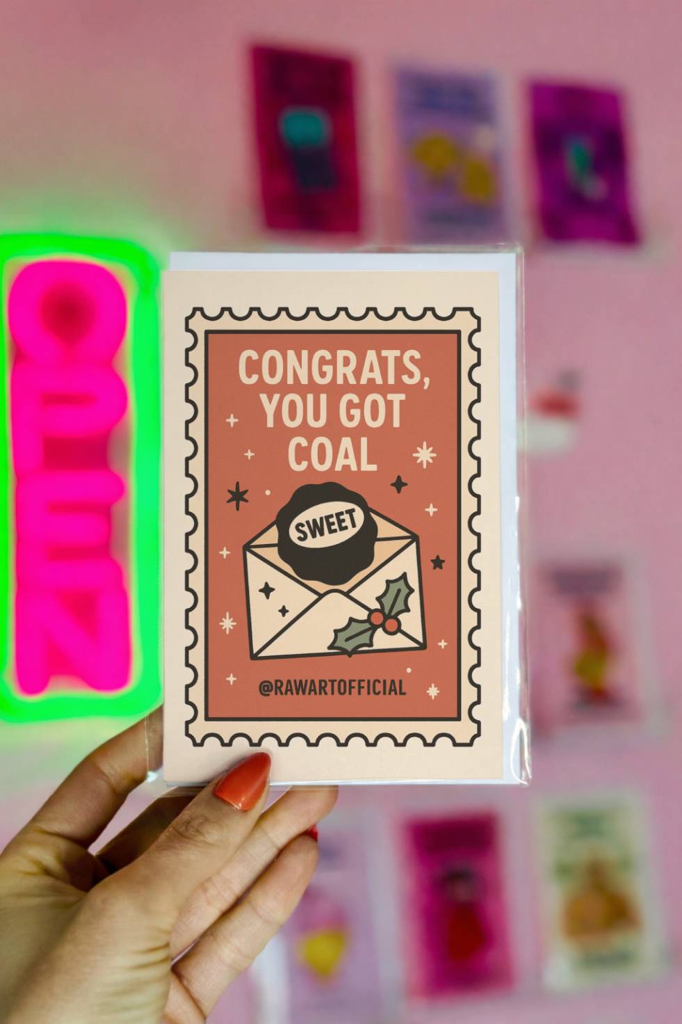 Funny Christmas greeting card with envelope and coal that reads “Congrats You Got Coal.”