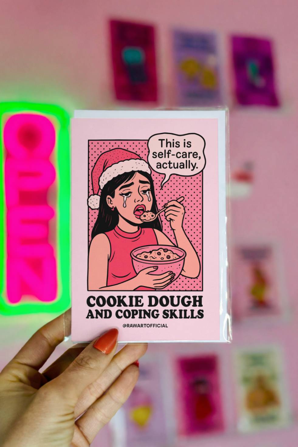 Funny Christmas greeting card featuring a retro comic-style woman in a Santa hat eating cookie dough with the caption “Cookie Dough and Coping Skills.”