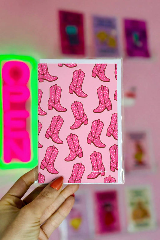Greeting card featuring a repeating pattern of pink sparkly cowgirl boots on a soft pink background in a western party style.