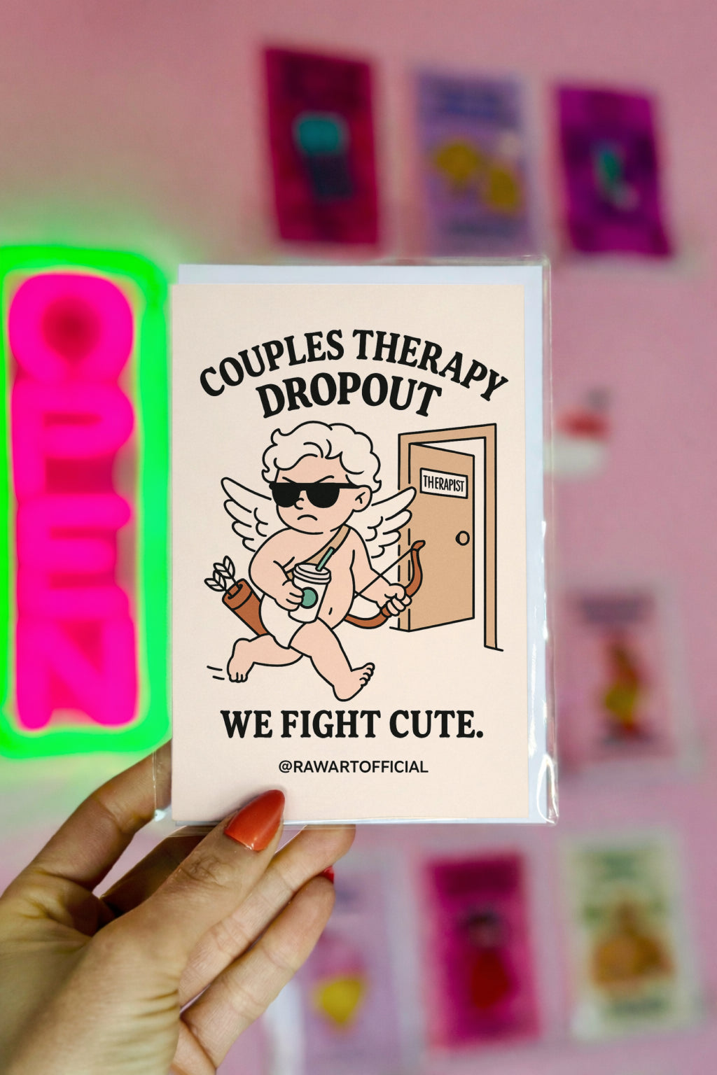 Cartoon Cupid leaving therapy office with iced coffee, bow, and sunglasses — text reads “Couples Therapy Dropout. We Fight Cute.”