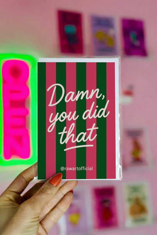 Pink and green striped greeting card with white script text reading “Damn, you did that.”