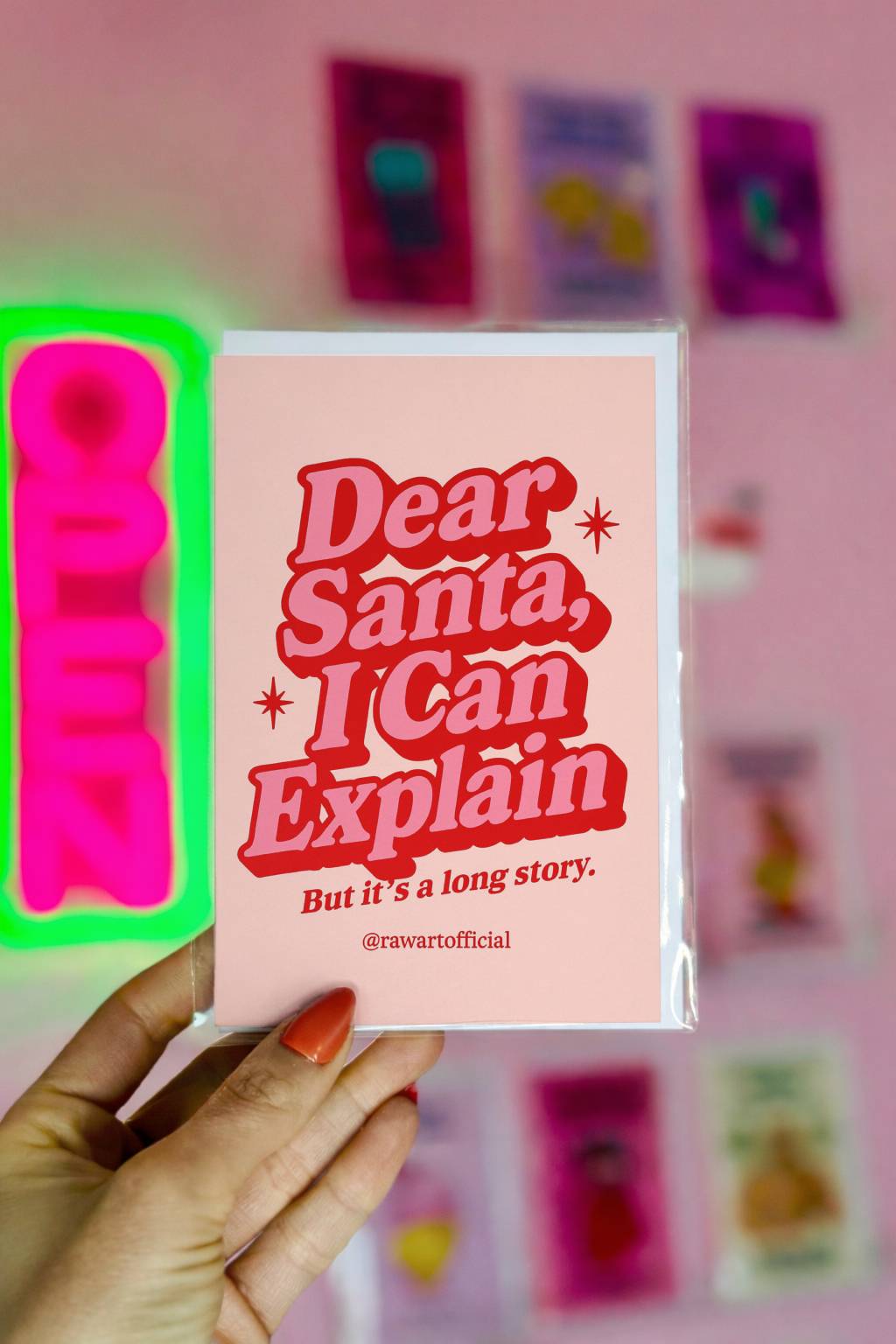 Funny Christmas card with retro red typography reading “Dear Santa I Can Explain But it’s a long story” on a pink background