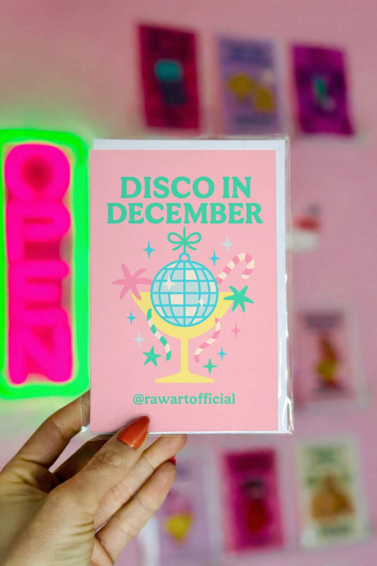 Funny Christmas greeting card with disco ball cocktail and text “Disco in December.”