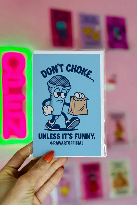 Greeting card featuring a cartoon microphone holding a paper bag with the text “Don’t Choke… Unless It’s Funny.”