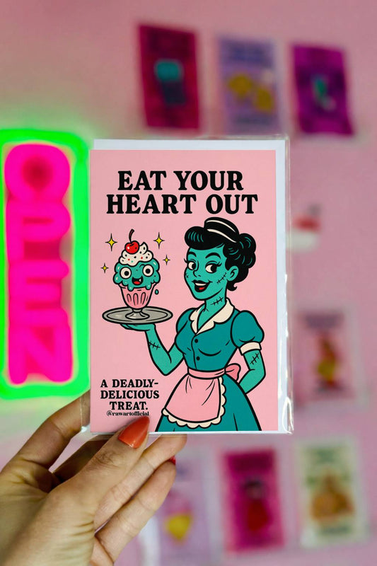 Retro zombie waitress holding sundae with eyeballs, text “Eat Your Heart Out” funny spooky greeting card