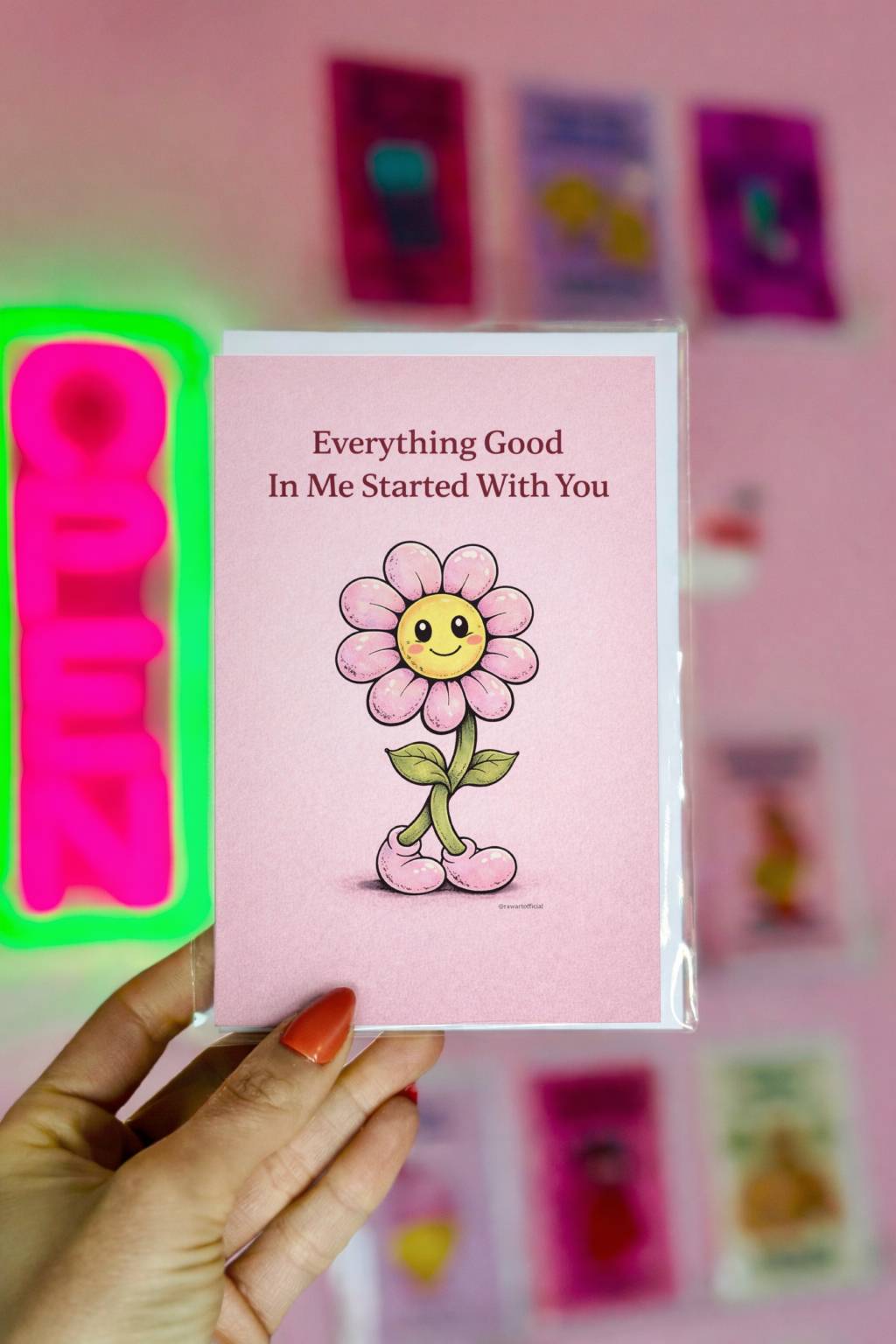 sentimental mother’s day card featuring smiling pink flower character with boots and text everything good in me started with you on soft pink background