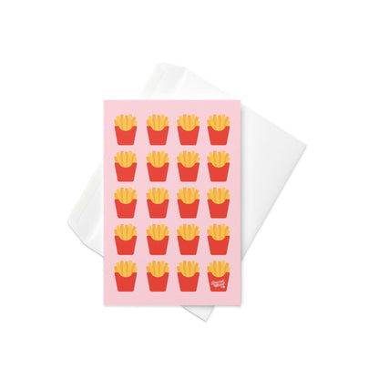 Greeting card featuring a repeating pattern of illustrated french fries in red cartons on a soft pink background.
