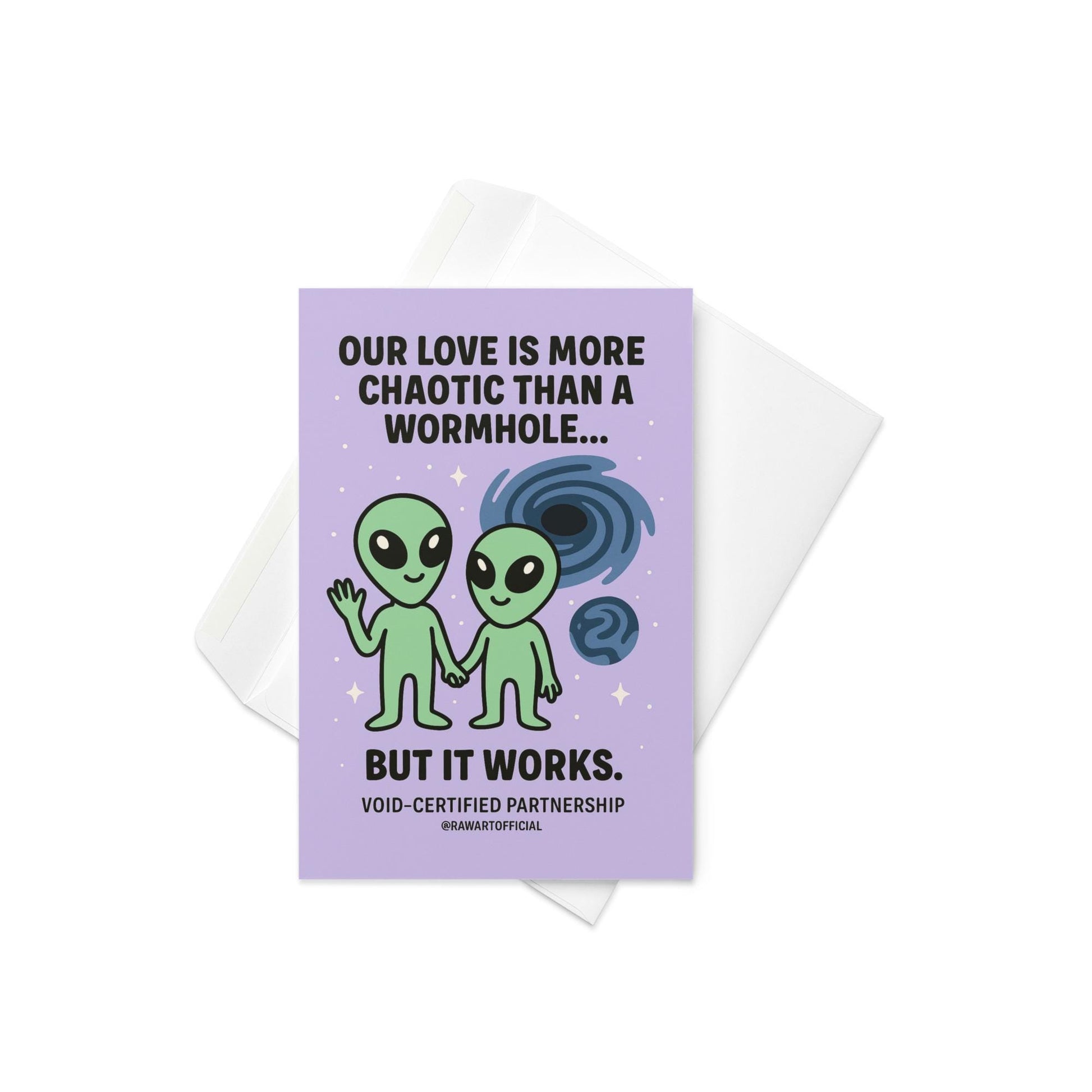 Greeting card with a purple background featuring two green alien figures and the text "OUR LOVE IS MORE CHAOTIC THAN A WORMHOLE... BUT IT WORKS." 