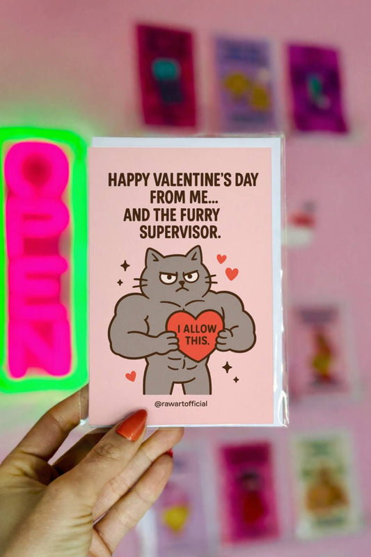 Funny Valentine card with muscular cartoon cat holding a heart that says “I allow this” and text about a furry supervisor.