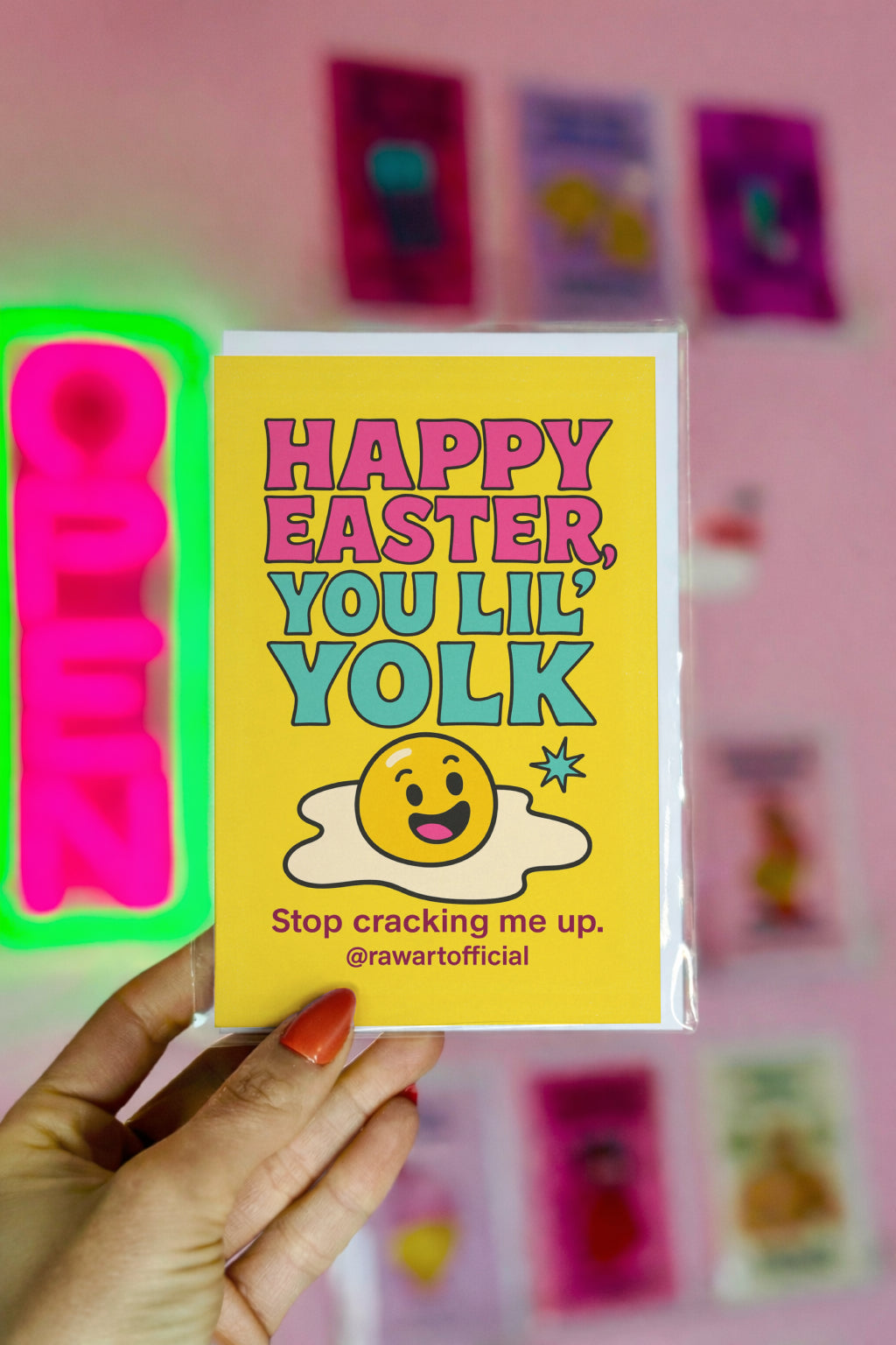 bright yellow easter card with smiling yolk character and bold pink and teal text funny egg pun holiday card