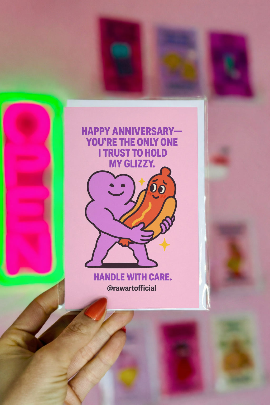 Cute cartoon heart character holding shy hot dog glizzy for funny anniversary card by @rawartofficial.