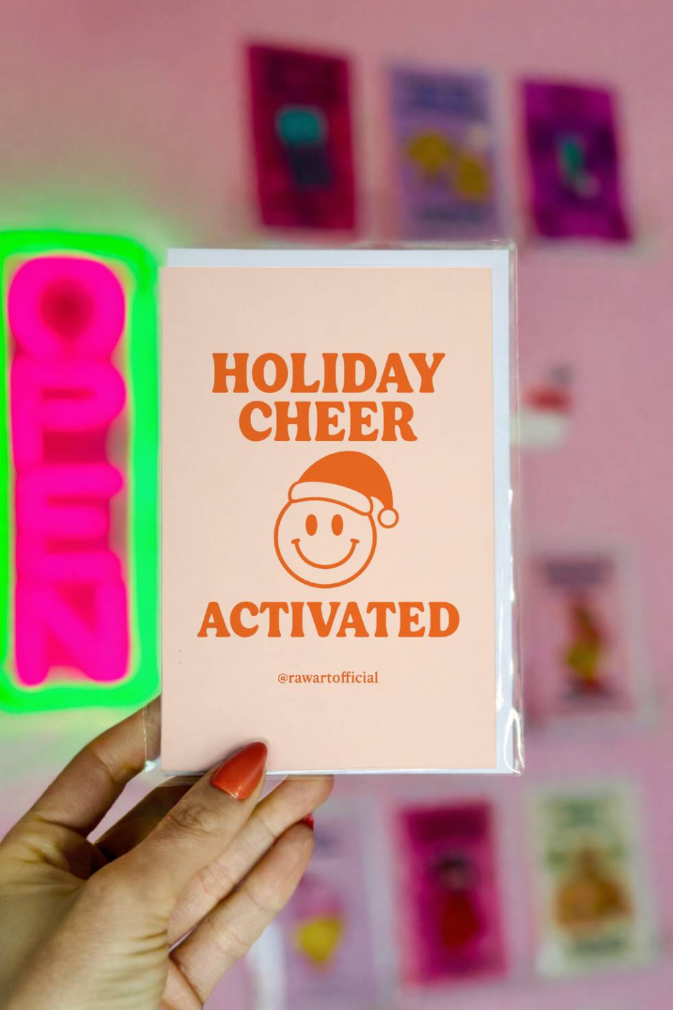 Funny Christmas card reading “Holiday Cheer Activated” with smiley face wearing a Santa hat on a minimal background.