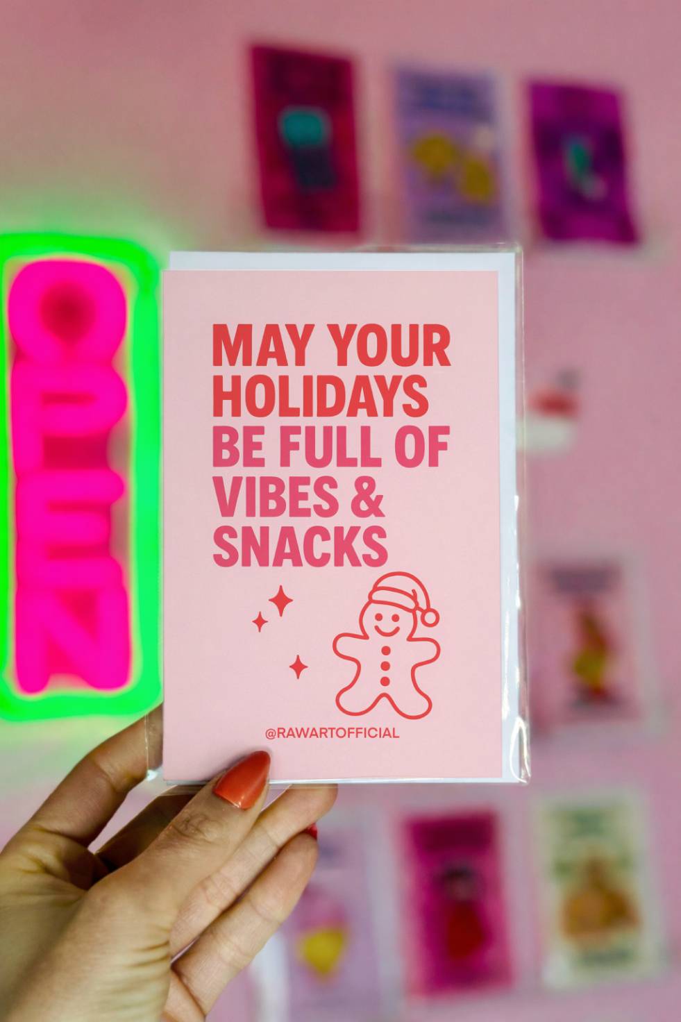 Funny Christmas card reading “May Your Holidays Be Full of Vibes and Snacks” with a small gingerbread character wearing a Santa hat.