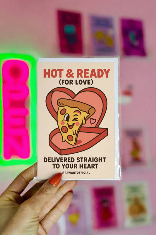 Funny greeting card reading “Hot & Ready for Love – Delivered Straight to Your Heart” with a cartoon pizza slice in a heart-shaped pizza box.