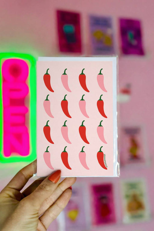 Funny greeting card with a repeating red and pink chili pepper pattern on a pastel background in a bold retro style