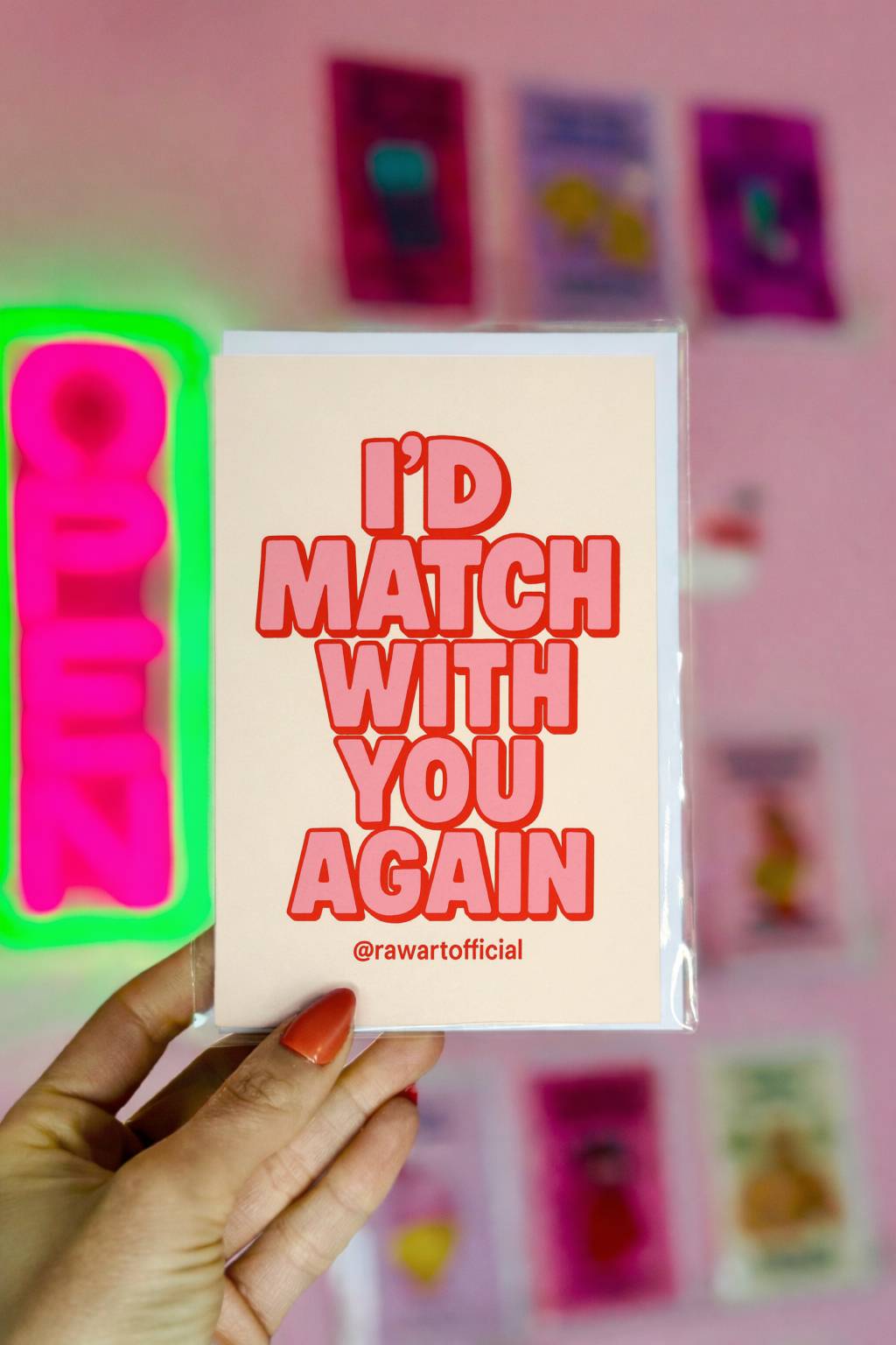 Cream greeting card with bold pink retro typography reading I’d Match With You Again and @rawartofficial at bottom.