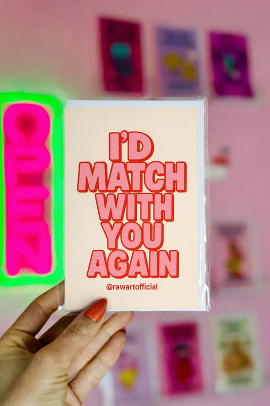 Cream greeting card with bold pink retro typography reading I’d Match With You Again and @rawartofficial at bottom.
