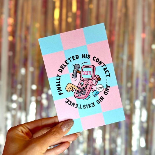 Y2K-style greeting card with a pink and teal checkered background, featuring a cartoon flip phone smashing itself with a hammer. Text reads “Finally deleted his contact… and his existence.” Perfect for breakup vibes.