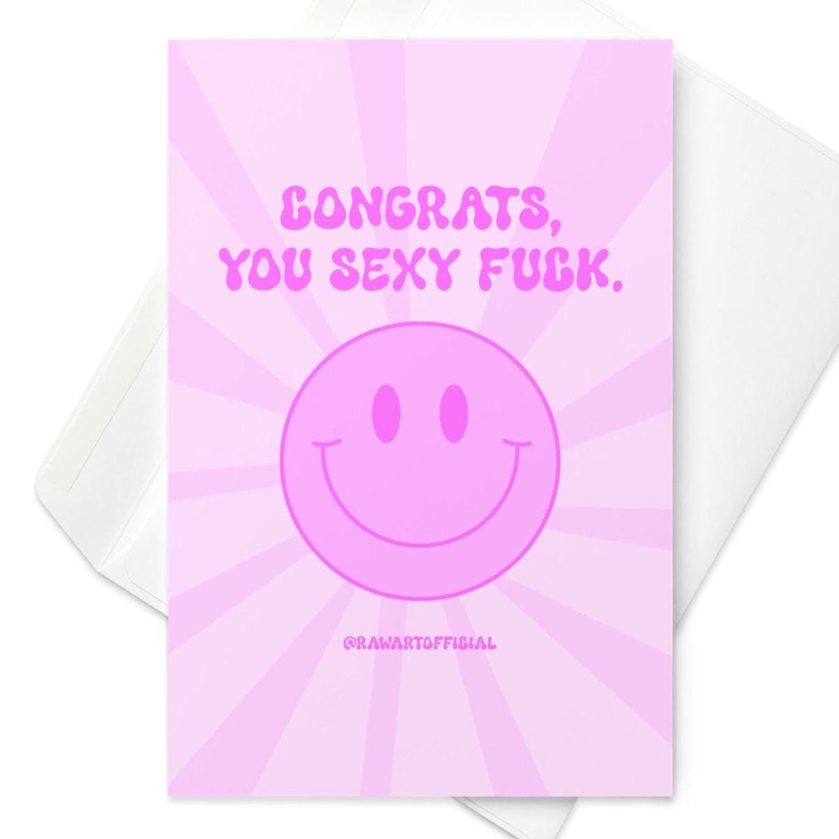 Pink retro greeting card with bold text reading &quot;Congrats, You Sexy Fuck&quot; and a big smiling face