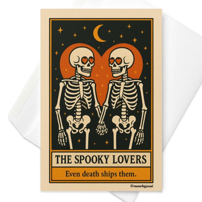 Tarot-style greeting card featuring two skeletons with heart-shaped eyes holding hands under a crescent moon, framed by an orange heart on a black starry background with the text “The Spooky Lovers – Even death ships them.”
