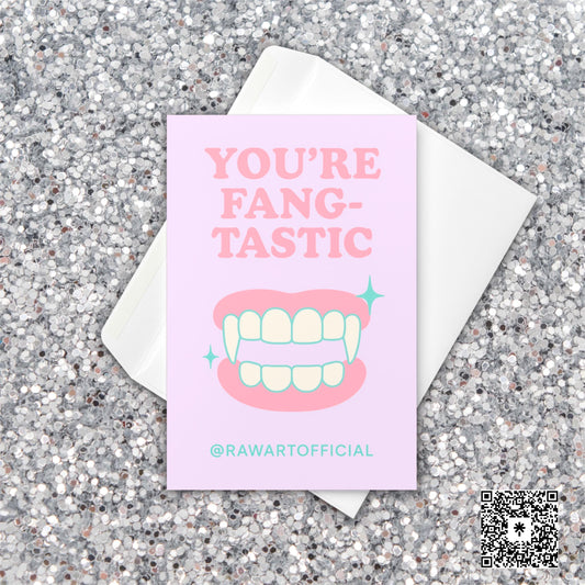 “You’re Fangtastic” Halloween card with cartoon vampire fangs in pastel pink and mint
