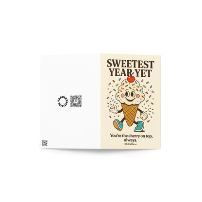 Cream birthday card featuring retro ice cream cone with sprinkles and cherry with text “Sweetest Year Yet.”