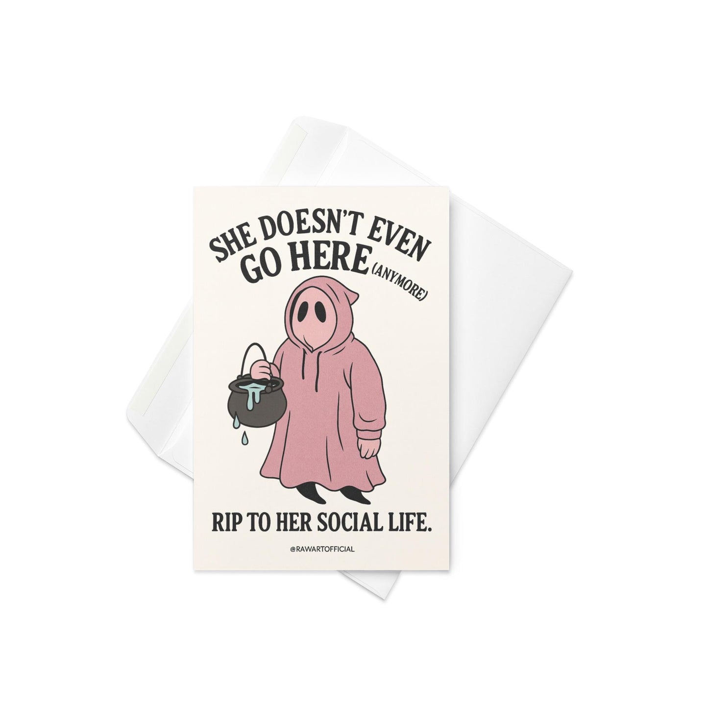 Pink ghost in a hoodie holding a cauldron with text “She Doesn’t Even Go Here (Anymore)” – funny Mean Girls inspired Halloween card.