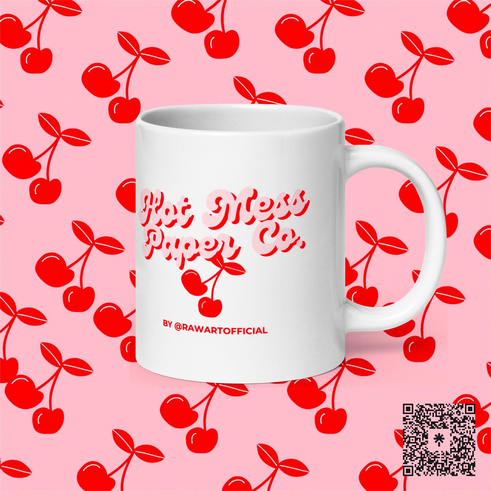 White mug with Hot Mess Paper Co. cherry design, pink cherry background